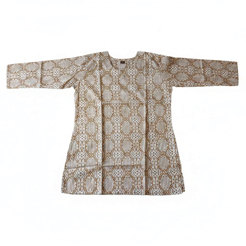 A long-sleeved batik tunic top with a brown and beige geometric pattern, laid flat on a bright green fabric background.