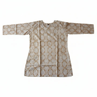 A long-sleeved batik tunic top with a brown and beige geometric pattern, laid flat on a bright green fabric background.