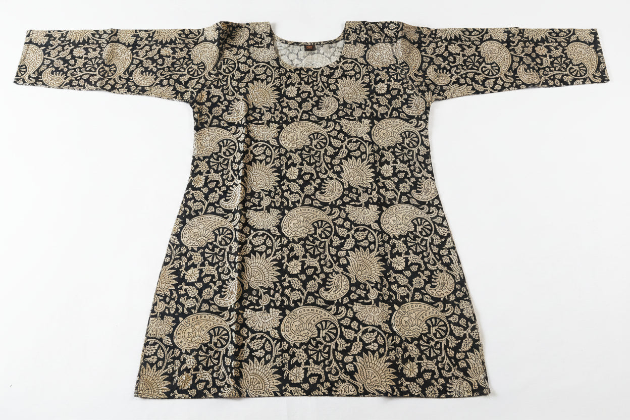 A long-sleeved tunic or kaftan-style top with an intricate black and beige floral pattern