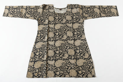 A long-sleeved tunic or kaftan-style top with an intricate black and beige floral pattern