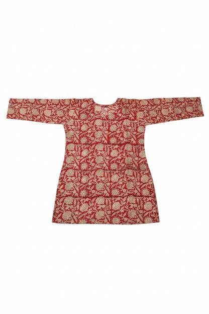 A long-sleeved tunic with a red and white floral block-print pattern.