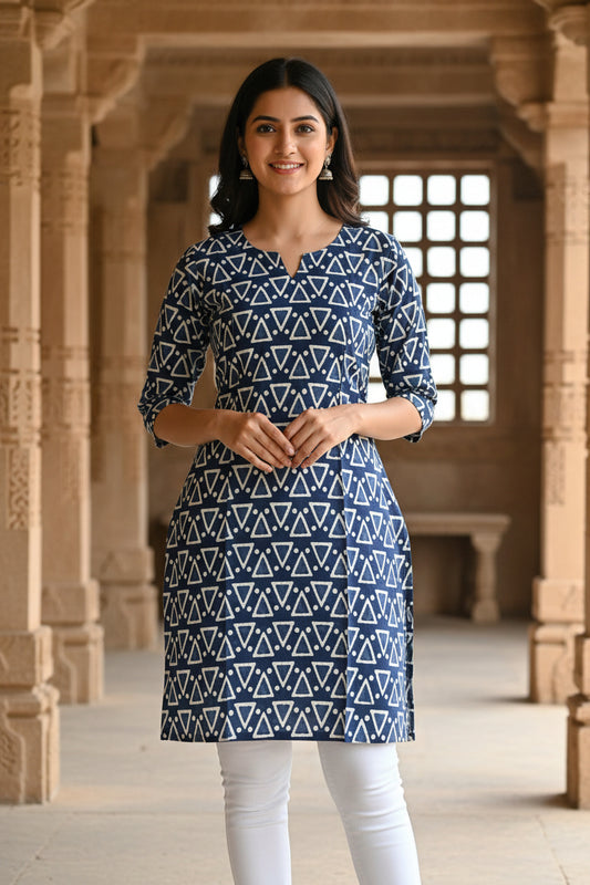 A long-sleeved tunic dress with a navy blue and white geometric triangle pattern.