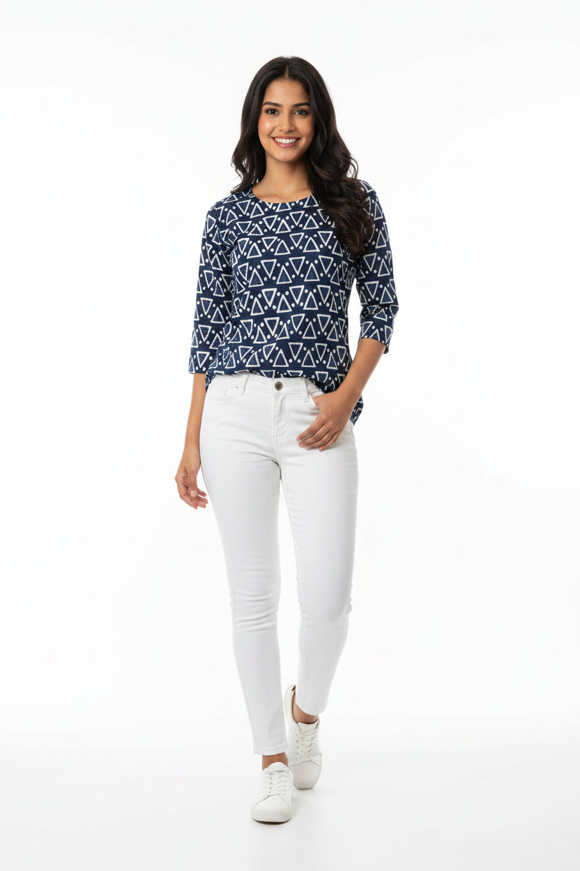 A long-sleeve tunic dress with a navy blue and white geometric triangle pattern.