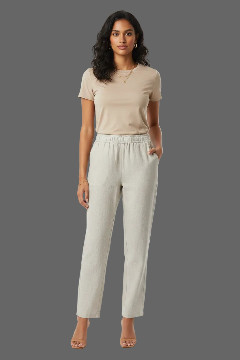 A pair of light beige linen trousers with an elastic drawstring waist.