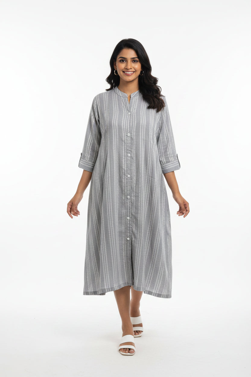 A light gray and white vertically striped long-sleeve tunic dress with a button-down front
