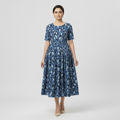 Woman wearing a blue floral dress on a light gray background