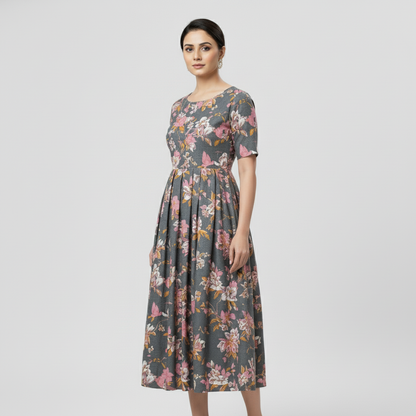 Woman wearing a floral dress on a light gray background